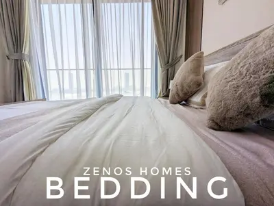 a bed with the words zermos homes bedding at Modern Luxury Fully Furnished 1BH Apartment in Binghatti Luna JVC - Easy Access to JBR, Circle Mall & Dubai Hills Mall in Dubai