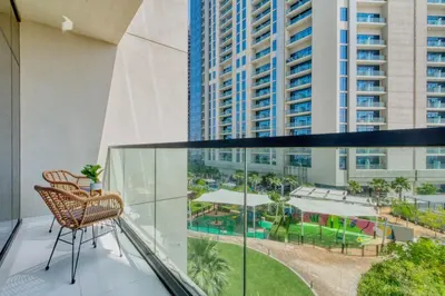 a balcony with chairs and a view of a city at GuestReady - Luxury Oasis in Business Bay in Dubai