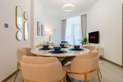 a dining room with a table and chairs at Upscale 1BR Luxury Apt in Business Bay in Dubai