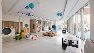 a large living room with a table and some balloons at Luxury 4BR Full Burj khalifa & Fountain View, 1Gbps, PS5 in Dubai
