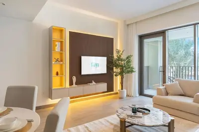 a living room with a couch and a table at FAM Living - Modern 1BR at Orchid, Creek Harbour in Dubai