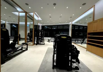 a gym with a luggage cart in the middle of a room at Modern Stay at The Address JBR in Dubai