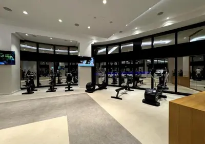 a gym with treadmills and machines in a building at Modern Stay at The Address JBR in Dubai