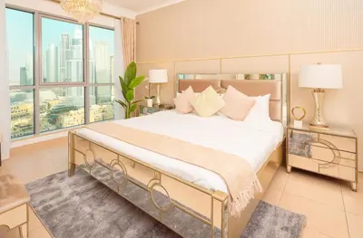 a bedroom with a large bed and a large window at Elite Royal Apartment - Sky Series - Best Burj Khalifa & Fountain View - High Floor - Visionary in Dubai