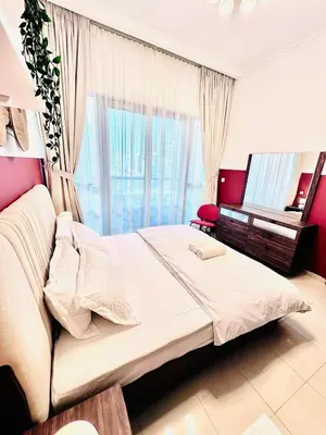 a bedroom with a large bed and a mirror at Bright and Modern Condo in Dubai Marina in Dubai
