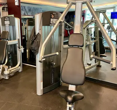 a gym with a treadmill and a chair in it at Stylish Apartment - Dubai Marina in Dubai