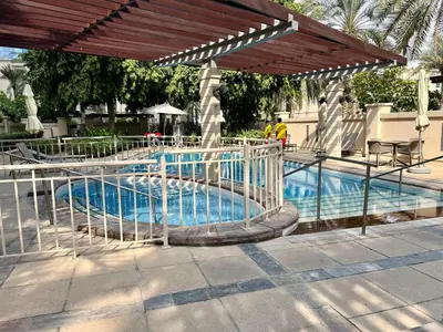 a swimming pool with a slide in a resort at Stylish Apartment - Dubai Marina in Dubai
