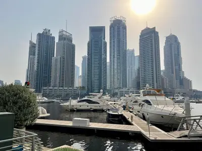 a group of boats docked at a marina in a city at Stylish Apartment - Dubai Marina in Dubai