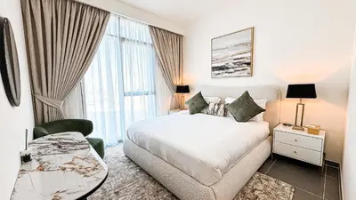a hotel room with a bed and a window at Luxury 2BHK & Lagoon view in Dubai