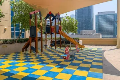 a playground with a checkered floor and slides at Downtown Luxury Large Studio Near Burj Khalifa with City Views, - Claren Tower 1, Downtown Dubai by Deluxe Holiday Homes in Dubai