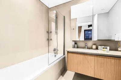 a bathroom with a shower and a sink at FIRST CLASS 2BR Design Meets Comfort in Dubai