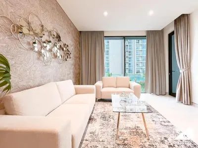 a living room with a couch and a table at Stunning 2-Bed Home in Sobha Creek Vistas in Dubai