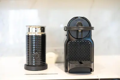 a black comb sitting next to a can on a counter at 41st-Floor 2BR with World's Highest Running Track in Dubai