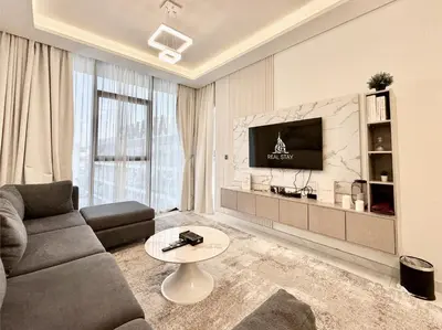 a living room with a couch and a tv at Exclusive 4 Months Offer Exclusive 3 bedroom with Private Pool with 1 free houskeeping in Dubai