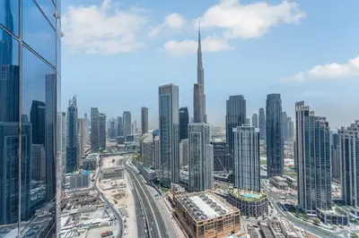 a view of a large city with tall buildings at Panoramic Burj Views, Famous Infinity Pool, Balcony Mini Golf - Paramount Midtown in Dubai