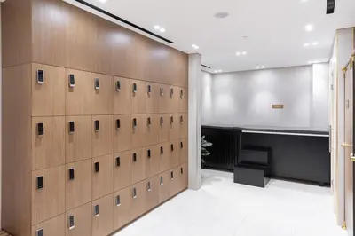 a locker room with a wall of lockers at Waves - Luxe Studio with Jacuzzi & City Views in Dubai