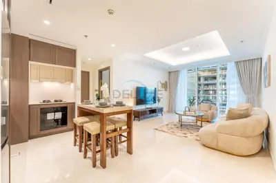 a living room with a kitchen and a dining room at Partial Marina and City Views 1BR, Close to JBR Beach, Palace Beach Residence Tower 2,Emaar Beachfront ,Dubai Marina by Deluxe Holiday Homes in Dubai