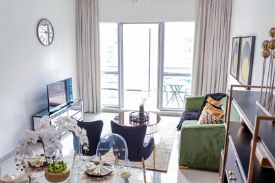 a living room with a table and chairs at Full Marina view, mins to JBR beach, Ain Dubai, Palm in Dubai