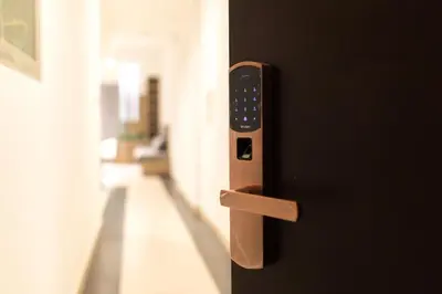 a close up of a door with a remote control at 1Bedroom Apartment with Portable bed in Living Area in Dubai