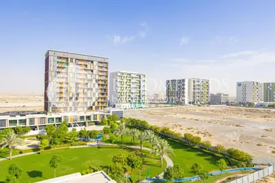 an aerial view of a city with tall buildings and a beach at Bloomfields 1br Elegant Escape The Pulse in Dubai