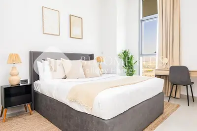 a bedroom with a large bed and a window at Bloomfields 1br Elegant Escape The Pulse in Dubai
