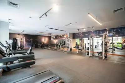a gym with treadmills and exercise equipment at Oasis by Tarrab in Dubai