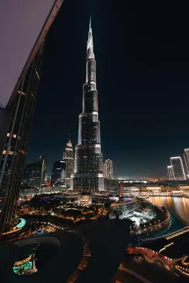 a view of the burj khalifa at night at Stylish 2-Bedroom Luxury Stay in Downtown Dubai with Burj Khalifa & Fountain Views in Dubai