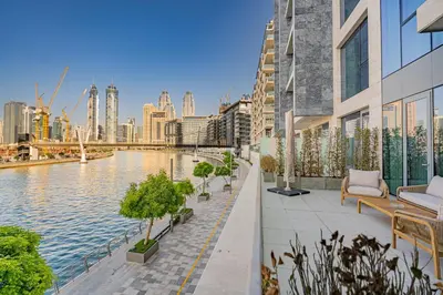 a balcony with a view of a river and a city at Escape24 Elegant 2BR with Canal view near Safa Park in Dubai