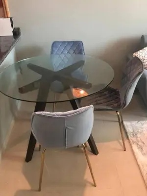 a glass table with two chairs and a glass table with a glass table at Luxury Apartment- 5 min Walking Distance Beach and 3 minutes walking distance Metro in Dubai