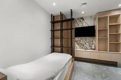 a bedroom with a bed and a flat screen tv at 3BR plus Maid Rimal 4 Direct Beach Access in Dubai