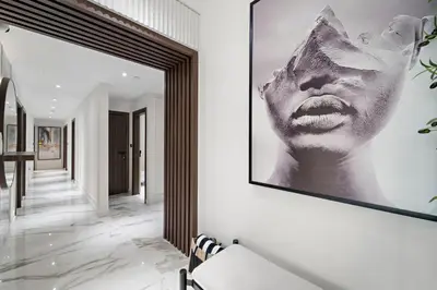 a hallway with a picture of a woman on the wall at 3BR plus Maid Rimal 4 Direct Beach Access in Dubai