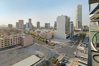 an aerial view of a city with tall buildings at Luxury 1BR JVC Pool & Balcony by Circle Mall in Dubai