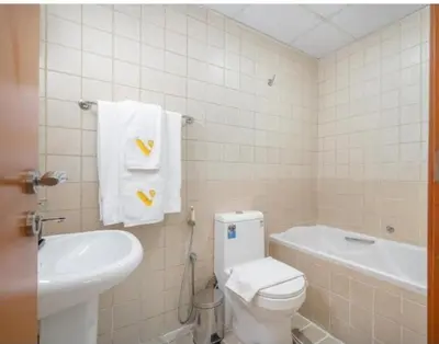 a bathroom with a white toilet and a sink at Dubai Marina-2Bedroom-3 balcony with view-direct acces to Marina Promenade in Dubai