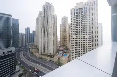 a view of a city with tall buildings and traffic at Charming Stay by Dubai Marina in Dubai