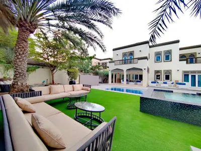 an exterior view of a villa with a swimming pool at Signature 7-bedroom Villa Marina in Dubai