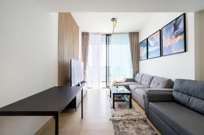 a living room with a couch and a table at Cozy NEW brand 1BR at JVC Binghatti Corner in Dubai
