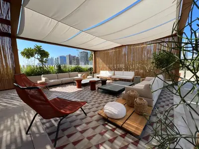 a living room with a couch and a chair at THE UPSIDE Downtown Dubai in Dubai
