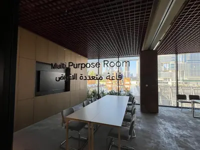 a conference room with a white table and chairs at THE UPSIDE Downtown Dubai in Dubai