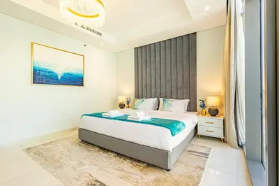 a bedroom with a large bed in a room at Infinity Rooftop Pool with Full Burj Khalifa View in Dubai