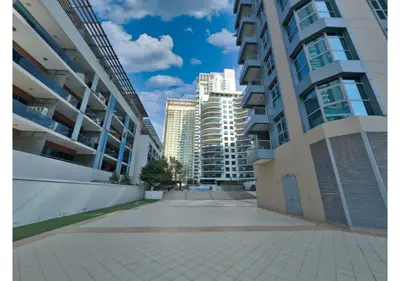 a street in a city with tall buildings at Luxe Vista - Top Location Dubai Marina 1BR - Metro and Beach Access in Dubai