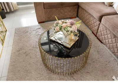 a coffee table with a bouquet of flowers on it at Luxe Vista - Top Location Dubai Marina 1BR - Metro and Beach Access in Dubai