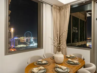 a dining room table with a view of the city at Sensational direct Sea, AIN View and Palm Jumeirah in Dubai Marina in Dubai