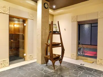 a wooden shelf in a room with a clock at Oceanfront 2BR Apartment with Perfect Views in Dubai