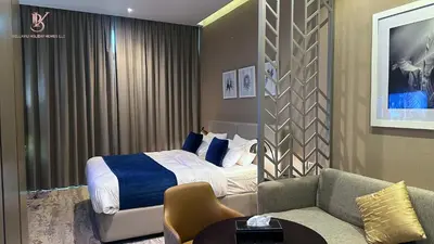 a hotel room with a bed and a couch at Bellaviu Holiday Homes Peaceful Escape at DAMAC Maison Prive in Dubai