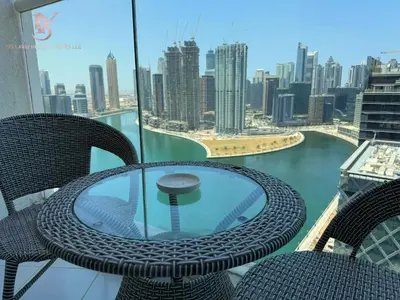 a table and chairs with a view of the city at Bellaviu Holiday Homes Peaceful Escape at DAMAC Maison Prive in Dubai