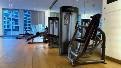 a gym with treadmills and machines in a building at Bellaviu Holiday Homes Peaceful Escape at DAMAC Maison Prive in Dubai