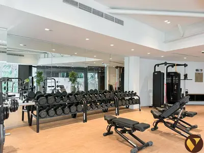a gym with a large mirror and lots of exercise equipment at Vogue JLT Banyan Tree Residences Hillside, near Marina and JBR, Two Bedroom Apartment with Balcony and City View, Access to all Amenities in Dubai