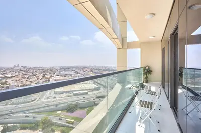 an office balcony with a view of a city at Aykon City 2BR Luxury Stay Close to Downtown in Dubai