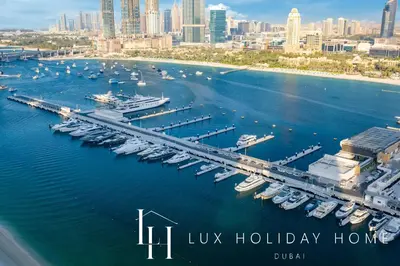 an aerial view of a marina with boats in the water at LUX The Marina Vista Beachfront Suite 5 in Dubai