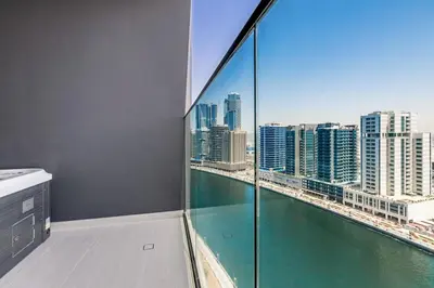 a bathroom with a view of a city skyline at Luxury Studio with Jacuzzi & Canal Views in Dubai